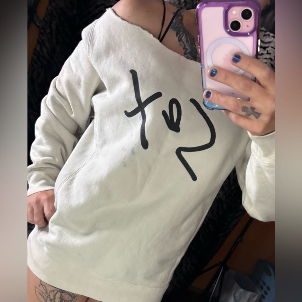 Off-Shoulder White Sweatshirt with Black Graphic